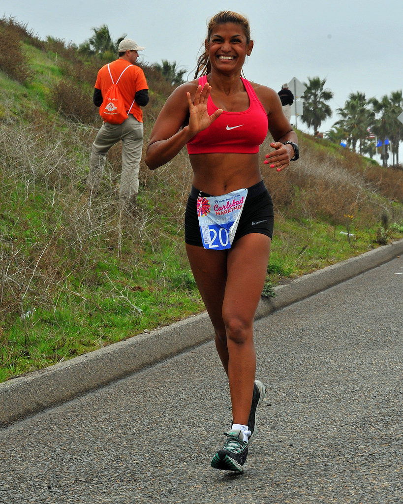 Woman running outdoors during follicular phase workouts